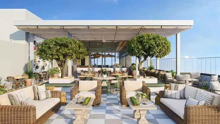 Rendering of a rooftop bar with vibrant patio seating. The bar area offers panoramic waterfront views