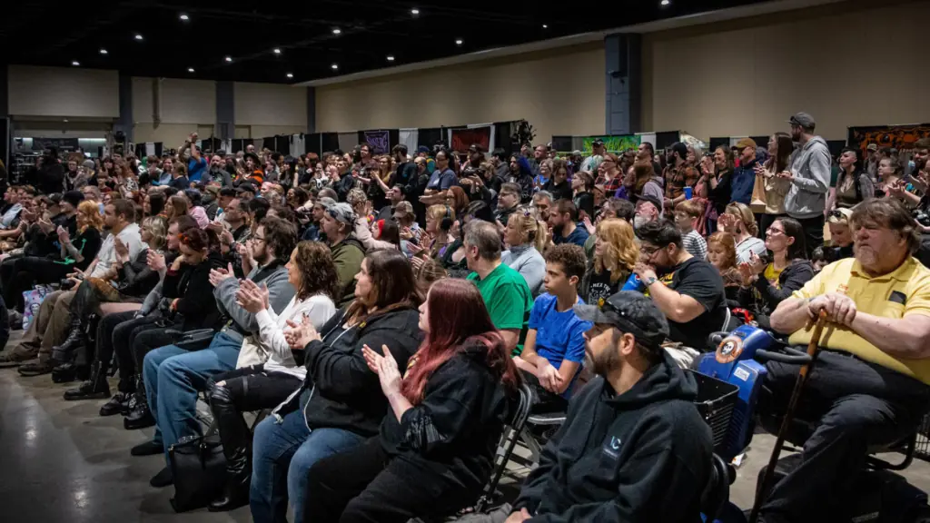 people in attendance listen to panel discussions