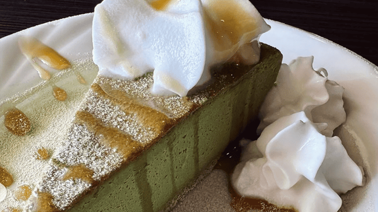 green tea cheesecake with whipped cream on top