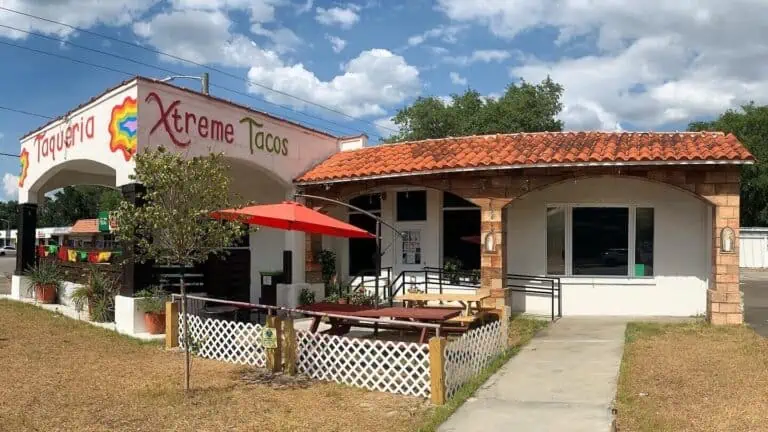 Facade of Xtreme Tacos restaurant with outdoor patio