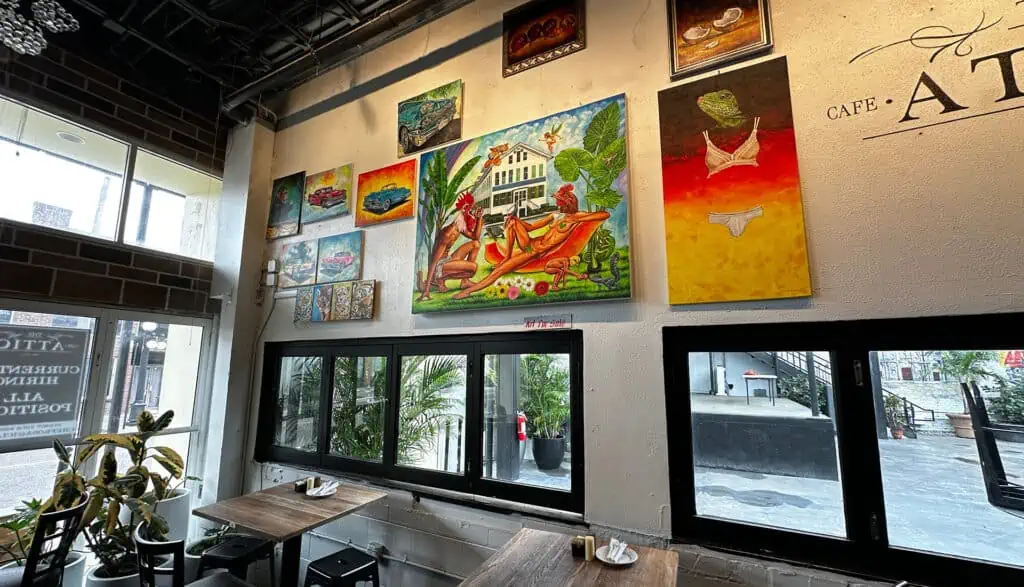 interior of a cafe with art on the walls 