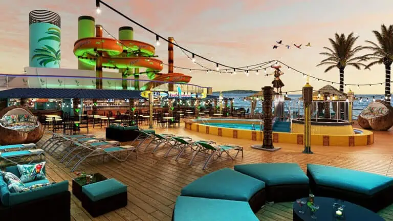 an outdoor bar on a cruise ship. Tall water slides that spiral can be seen in the background.