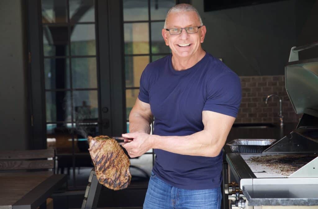 A chef holding meat