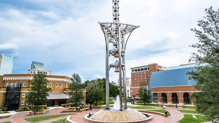 A large sculpture at the center of a college campus