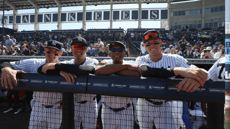 a group of baseball players in a dugout