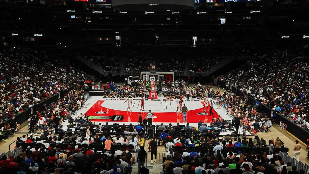 view o a half court basketball court with fans surrounding on all sides
