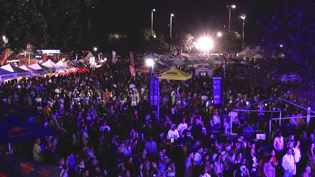 a large crowd enjoys live music and performances at an event