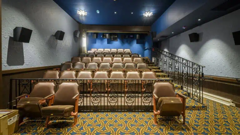 interior of a cinema with 50+ brown leather seats