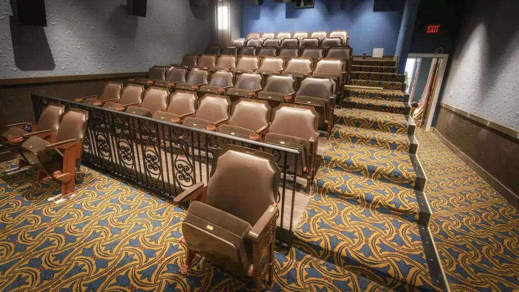 Interior of a movie theatre with brown leather seats