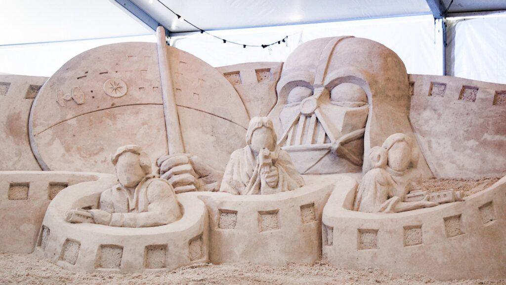 a large sand sculpture depicting characters from Star Wars 