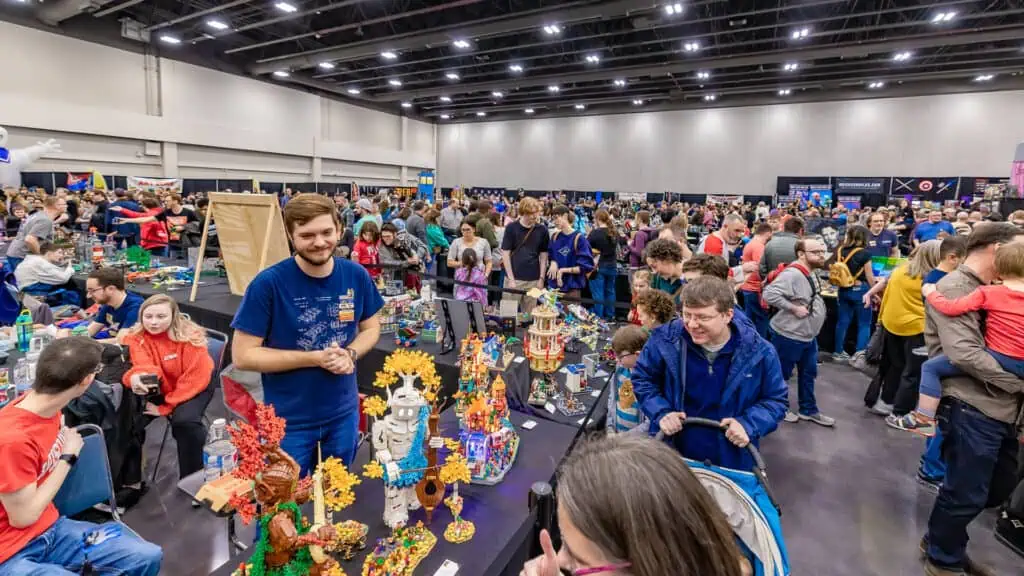 a big LEGO market with a huge crowd shopping at multiple vendors