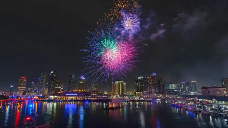 a fireworks display over a downtown area