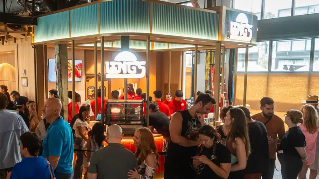 a food counter with multiple people enjoying food