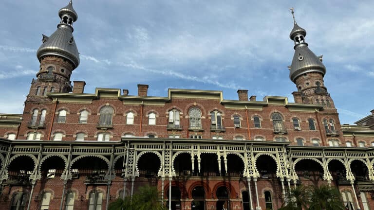 outside historic plant hall, a tall brick building with minarets on top