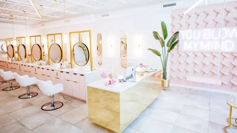 interior of a blow dry bar with pink tiles