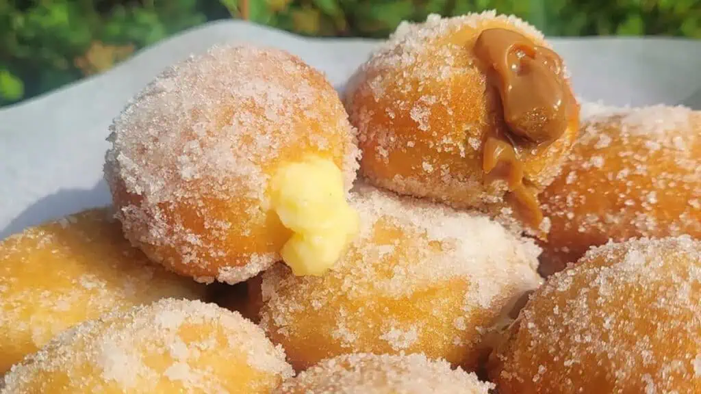 a plate of donuts filled with caramel