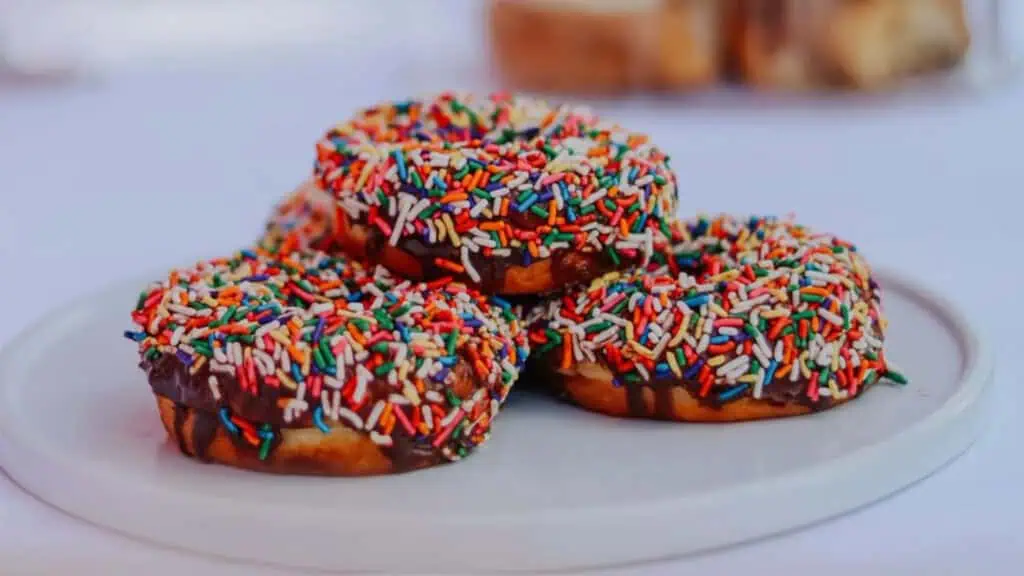 donuts covered in rainbow sprinkles 