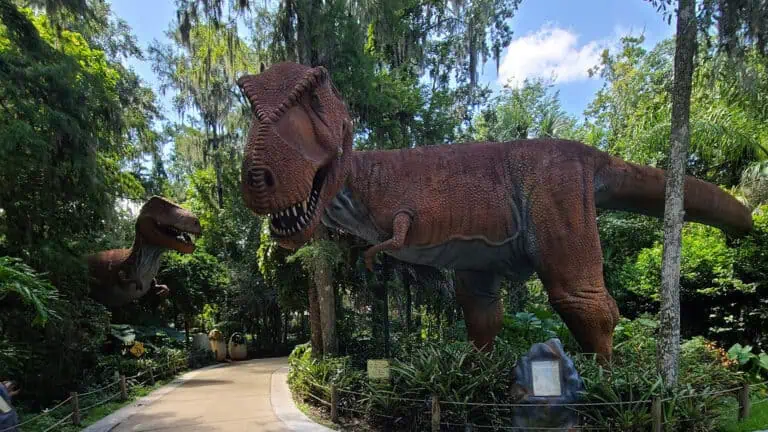 multiple giant dinosaurs set up on a winding trail