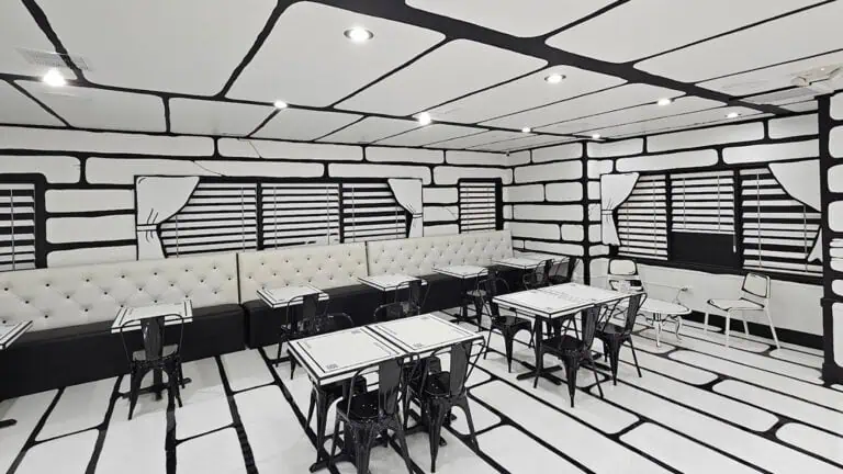 a restaurant with a 2D black and white aesthetic