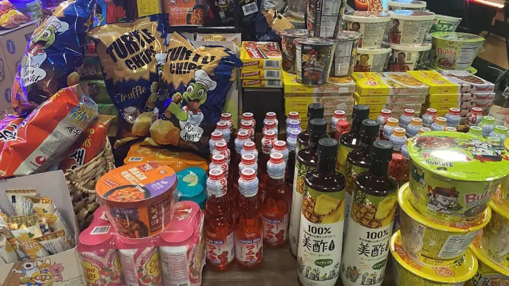 assortment of sauces and spices on display at a market