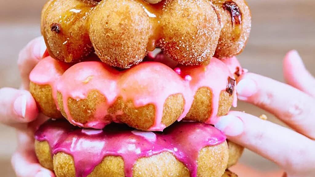 a stack of donuts covered in frosting