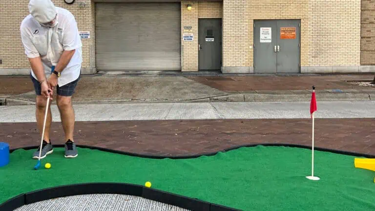 Mini golf set up on the street in a downtown area