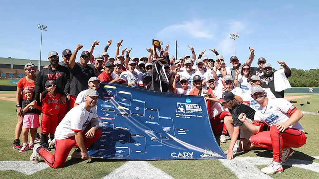 a group of baseball players celebrate a big championship