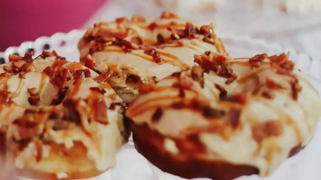 donuts covered in frosting and little bacon bits