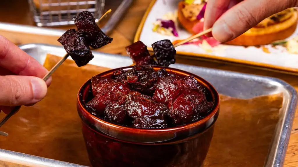 a bowl of crispy bacon burnt ends