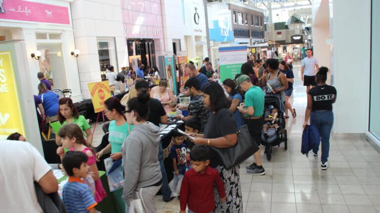 interior of a mall with vendors set up for a back to school event