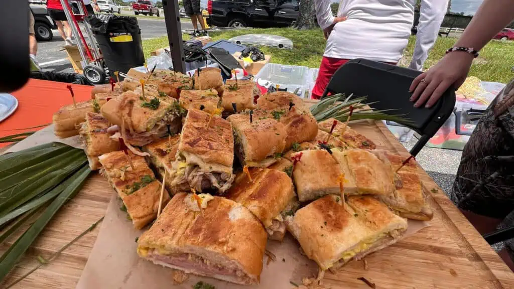 a plate of cuban sandwiches assembled at a Endor tent