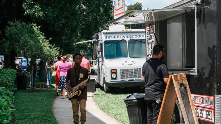 outdoor coffee and art festival. multiple food trucks are set up