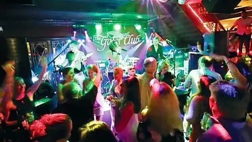 Patrons enjoy live music inside a bar