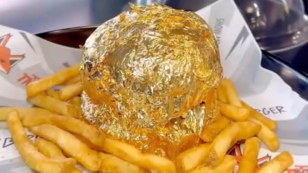 a burger wrapped in gold 