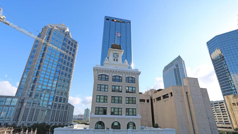 Photo of old city hall building with prominent clock tower.