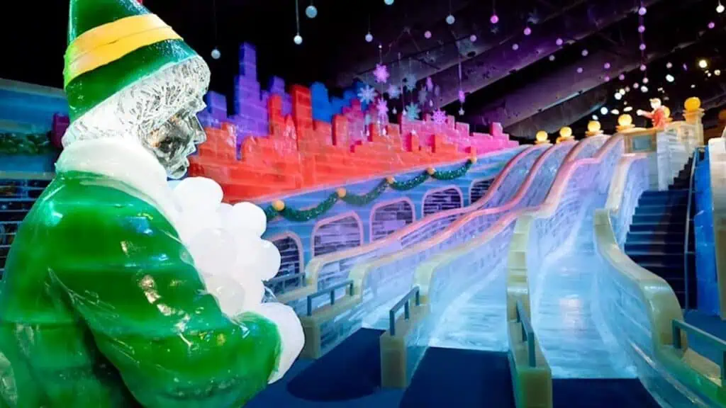 multiple ice slides set up inside a holiday themed attraction 