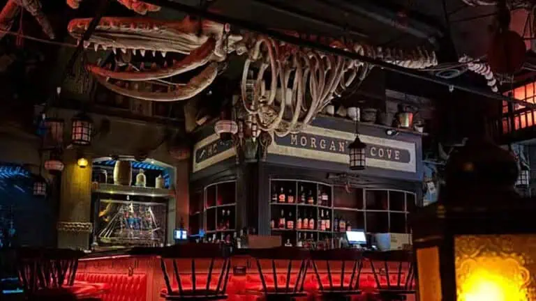 interior of a bar with pirate decor and large fish skeleton above the bar
