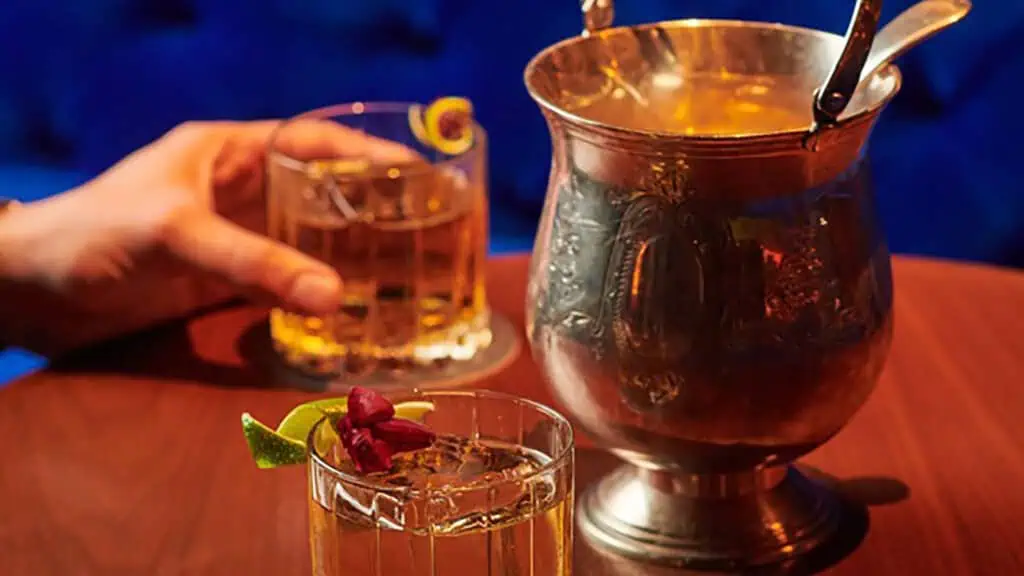 punch bowl with multiple cocktail glasses 