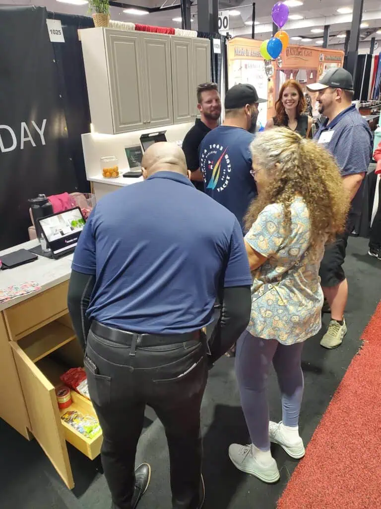 Two people looking at cabinetry