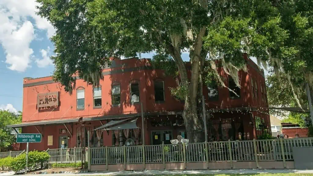 exterior of a cafe with a red brick exterior