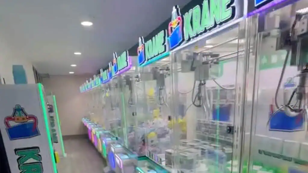 claw machine arcade with around a dozen machines 