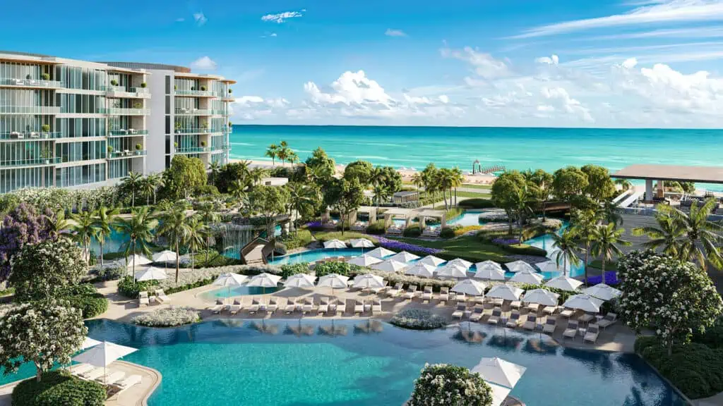 rendering of hotel with an expansive pool and ocean view.