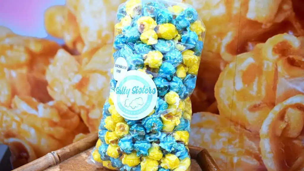 a bag of popcorn that is colored both blue and yellow