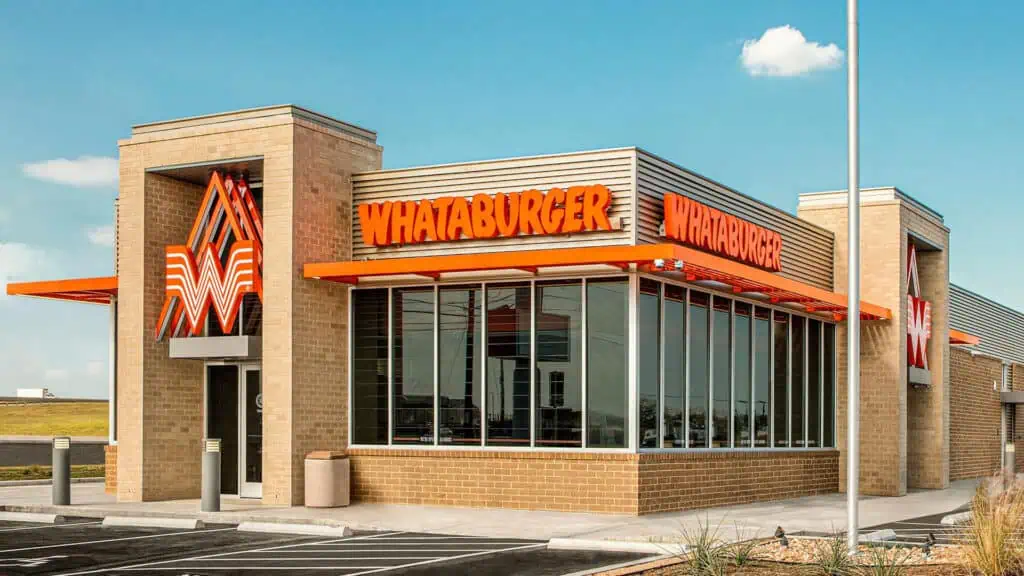 exterior of a burger restaurant with orange signage