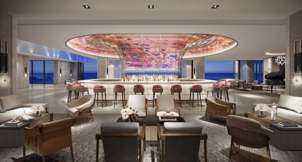 interior bar and lounge with chairs and an ocean view.