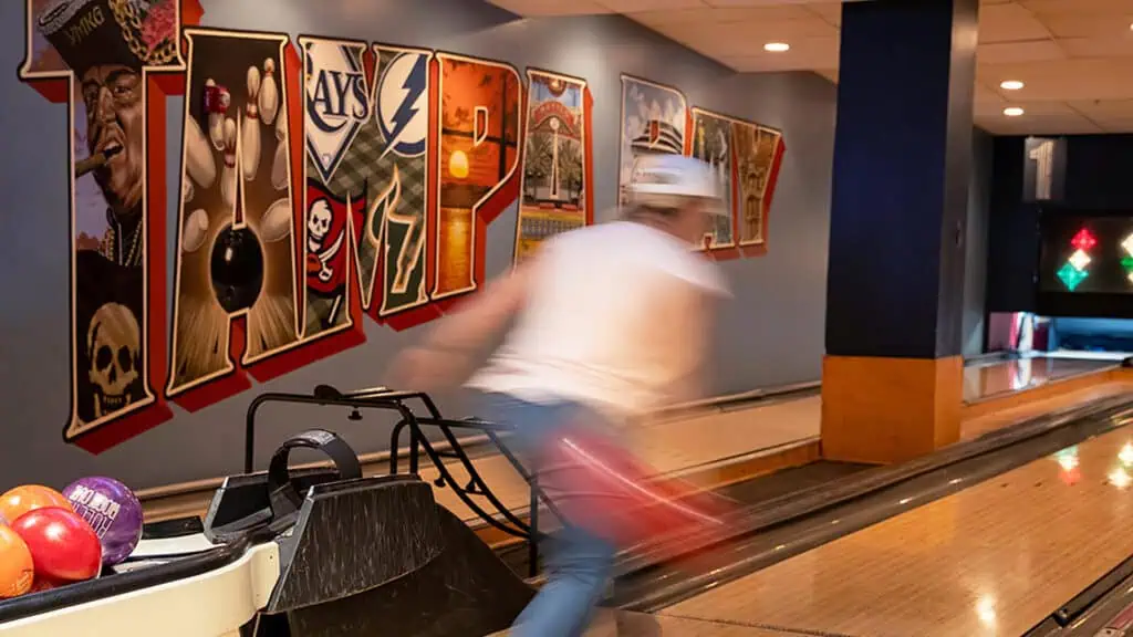 a person bowls at 10 pin lanes 