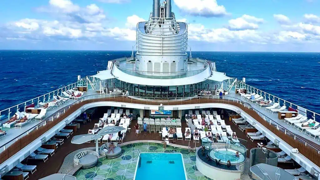 aerial view of a cruise ship deck with a big in ground pool