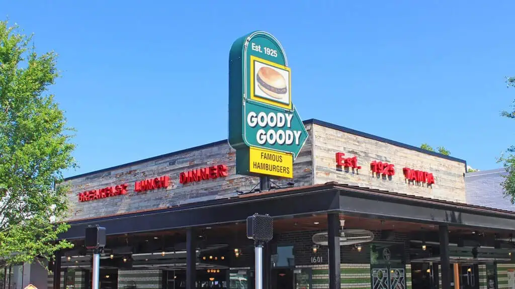 exterior of a restaurant with a green sign