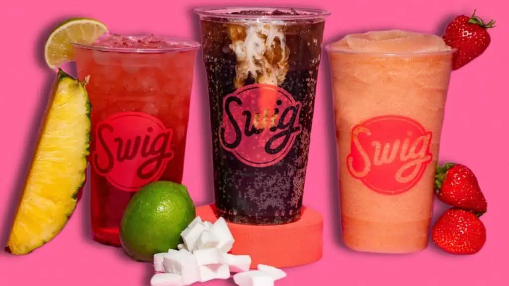 three different soda set against a pink background