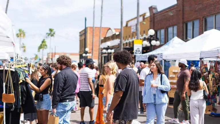 people shopping at an open air market in Ybor